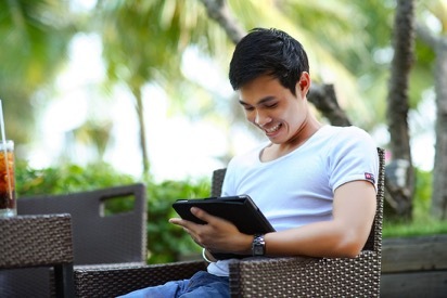 man looking at tablet man looking at tablet